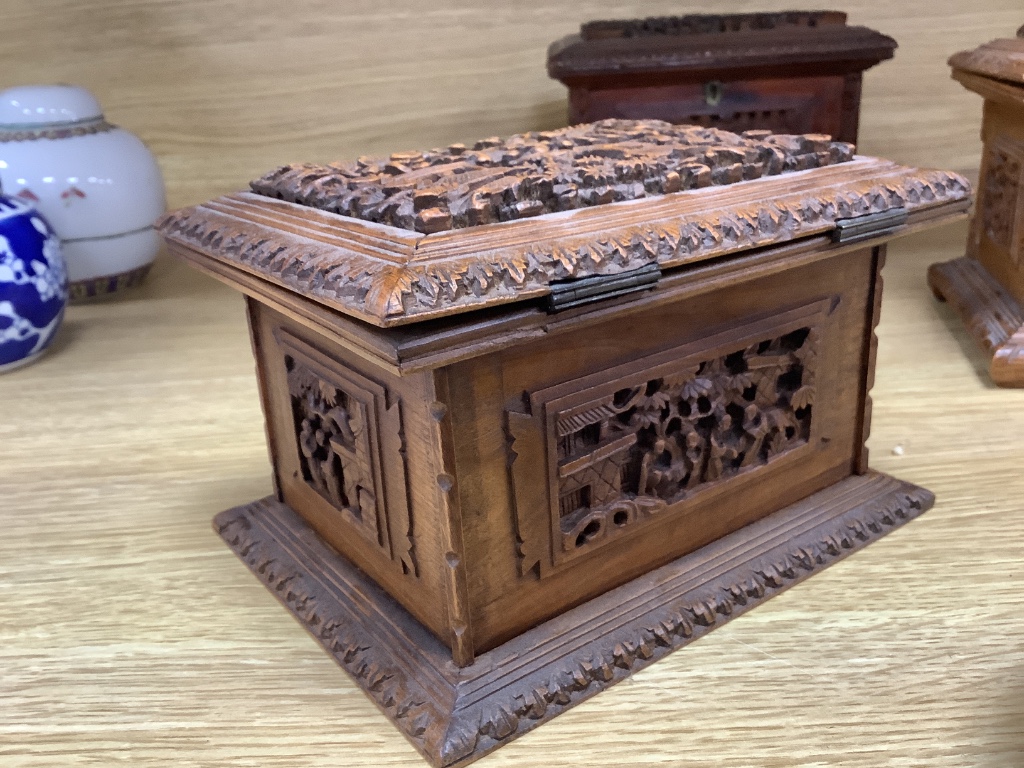 Three 19th century Chinese carved sandalwood caskets, longest 19cm